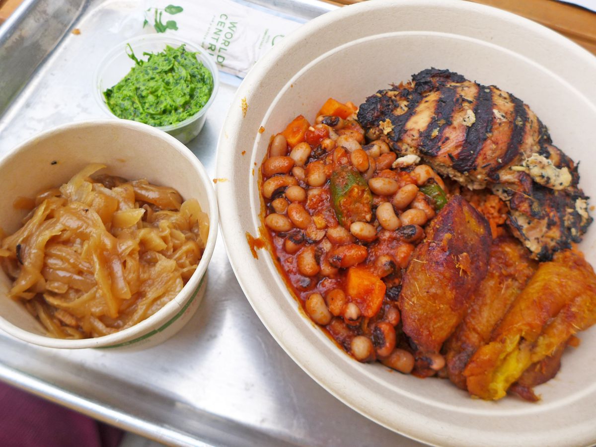 A bowl of grilled chicken and blackeyed peas with a green relish on the side.