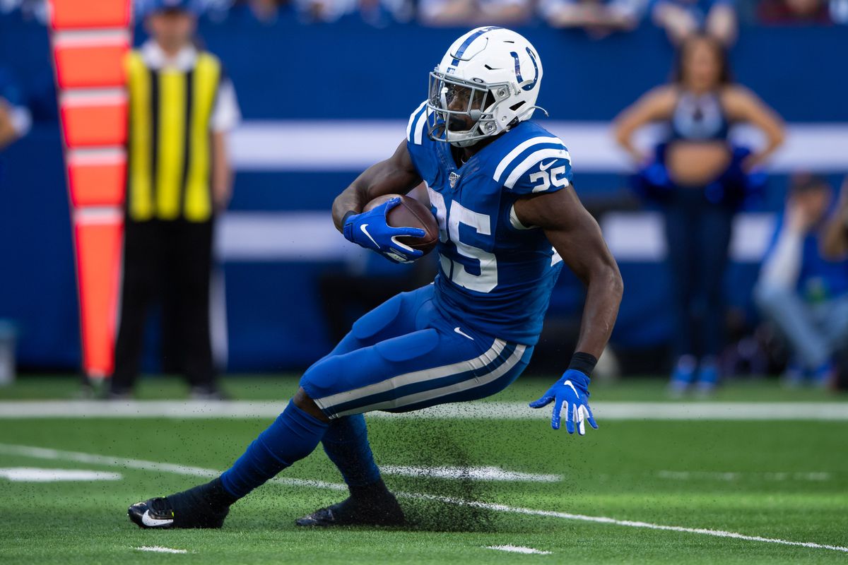 Indianapolis Colts running back Marlon Mack stumbles in the backfield during the NFL game between the Denver Broncos and the Indianapolis Colts on October 27, 2019 at Lucas Oil Stadium, in Indianapolis, IN.