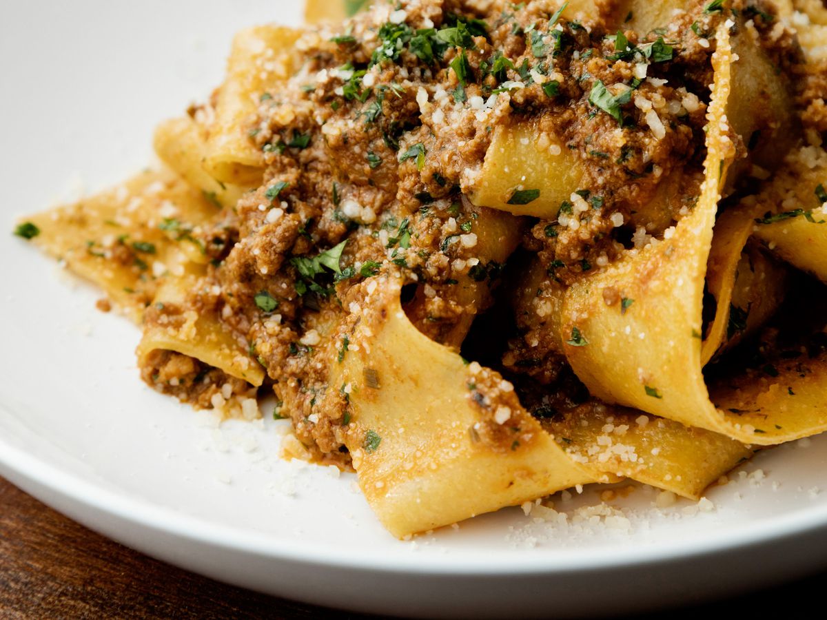 Ribbons of pappardelle noodles with meat sauce, topped with parmesan and parsley at Nobie’s.