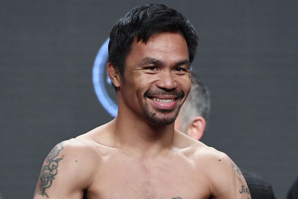 WBA welterweight champion Manny Pacquiao poses on the scale during his official weigh-in at MGM Grand Garden Arena on July 19, 2019 in Las Vegas, Nevada.
