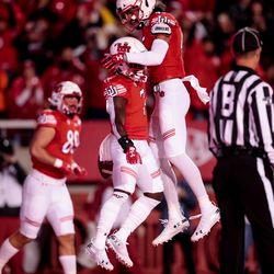 Utah Utes running back Devonta’e Henry-Cole (7) and wide receiver Samson Nacua (45) celebrate after Henry-Cole scored a touchdown on a pass from quarterback Tyler Huntley (1), putting the Utes up 7-0 over the Washington State Cougars after the PAT, at Rice-Eccles Stadium in Salt Lake City on Saturday, Sept. 28, 2019.
