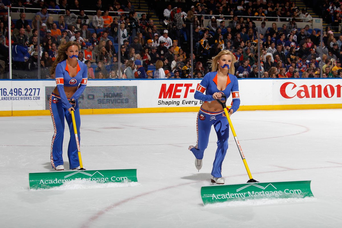 New York Islanders ice girls celebrate Movember by wearing fake mustaches during the game between the Isles and the Boston Bruins on November 2, 2013 in New York. (Photo by Bruce Bennett/Getty Images)