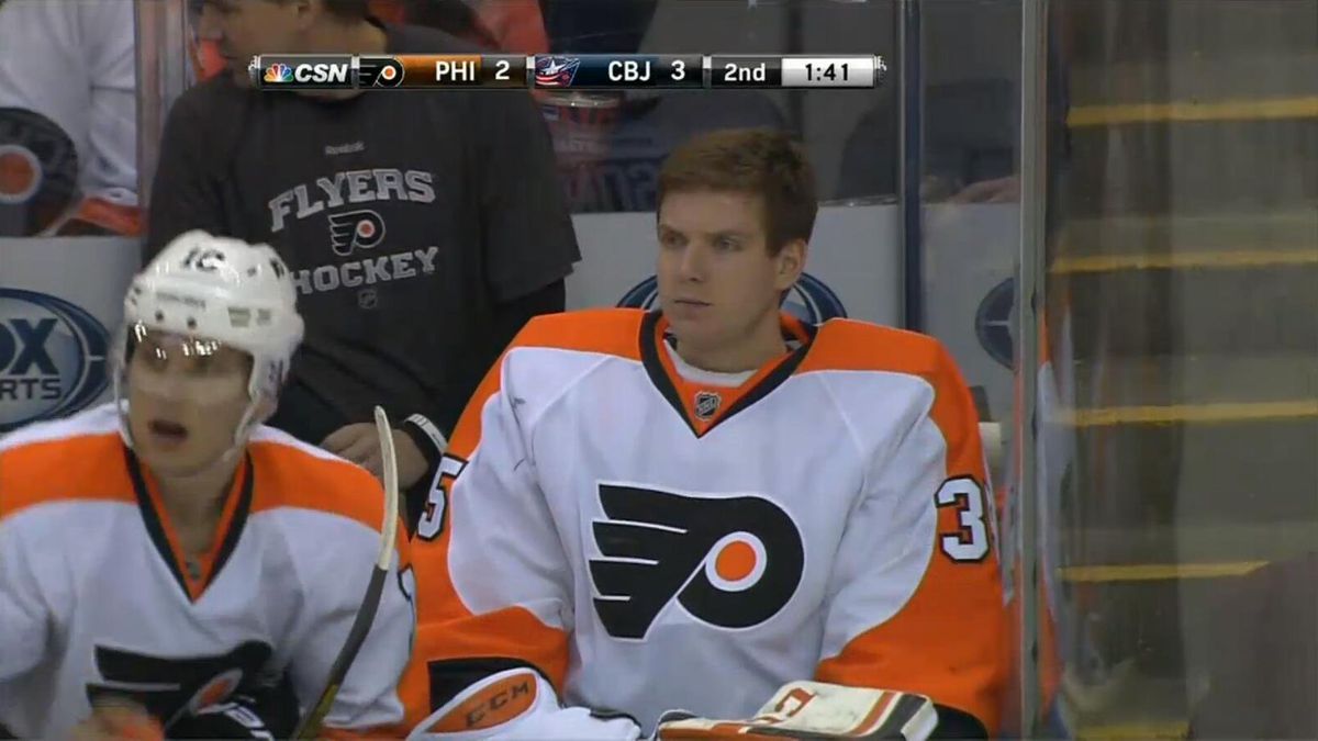 Philadelphia Flyers goalie Steve Mason sitting on the bench