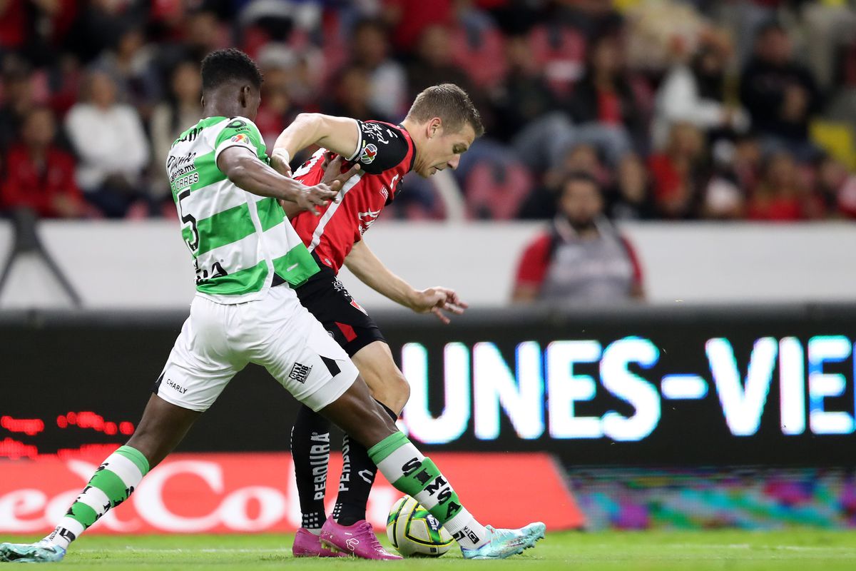 Julio Furch of Atlas fights for the ball with Félix Torres of Santos during the 4th round match between Atlas and Santos Laguna as part of the Torneo Clausura 2023 Liga MX at Jalisco Stadium on January 26, 2023 in Guadalajara, Mexico.