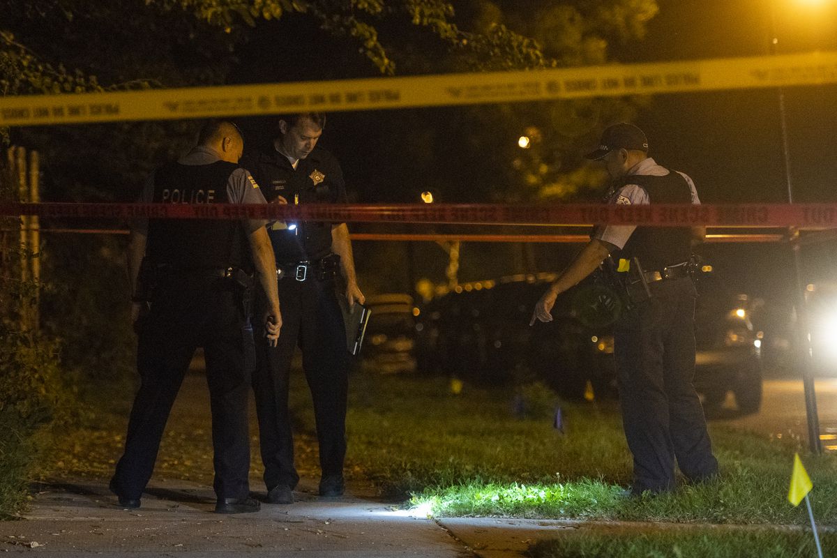 Police investigate the scene where a man was shot and killed Monday night in the 5700 block of South Winchester. | Tyler LaRiviere/Sun-Times