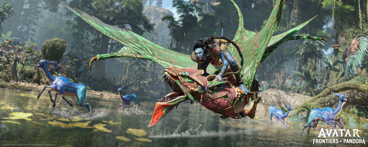 a Na’vi riding an Ikran over a forest lake as blue equine animals scatter behind it in Avatar: Frontiers of Pandora