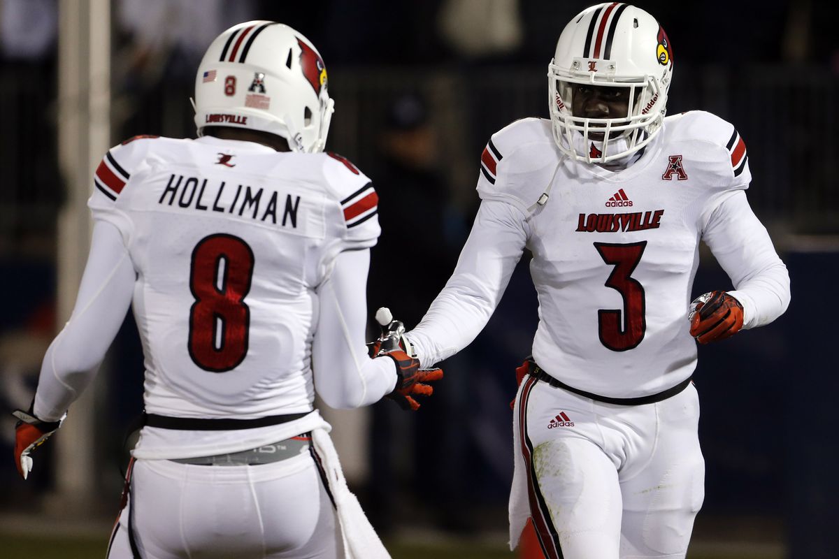 Louisville Cardinals safety Gerod Holliman (8) with teammate Charles Gaines (3).