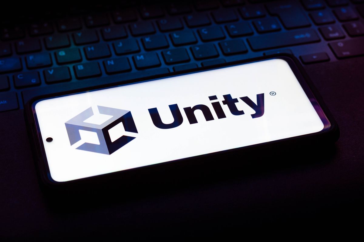 In this photo illustration the Unity Technologies logo is seen on a laptop keyboard