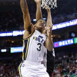 Utah Jazz's point guard Trey Burke (3) drives to the basket as the Utah Jazz and the San Antonio Spurs play Saturday, Dec. 14, 2013 at EnergySolutions Arena in Salt Lake City. The Spurs won 100-84.