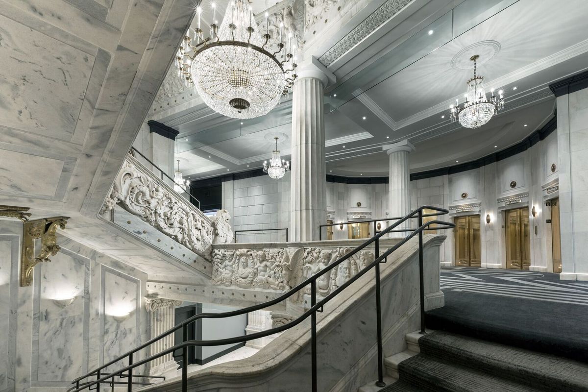 A grand lobby with staircases. 