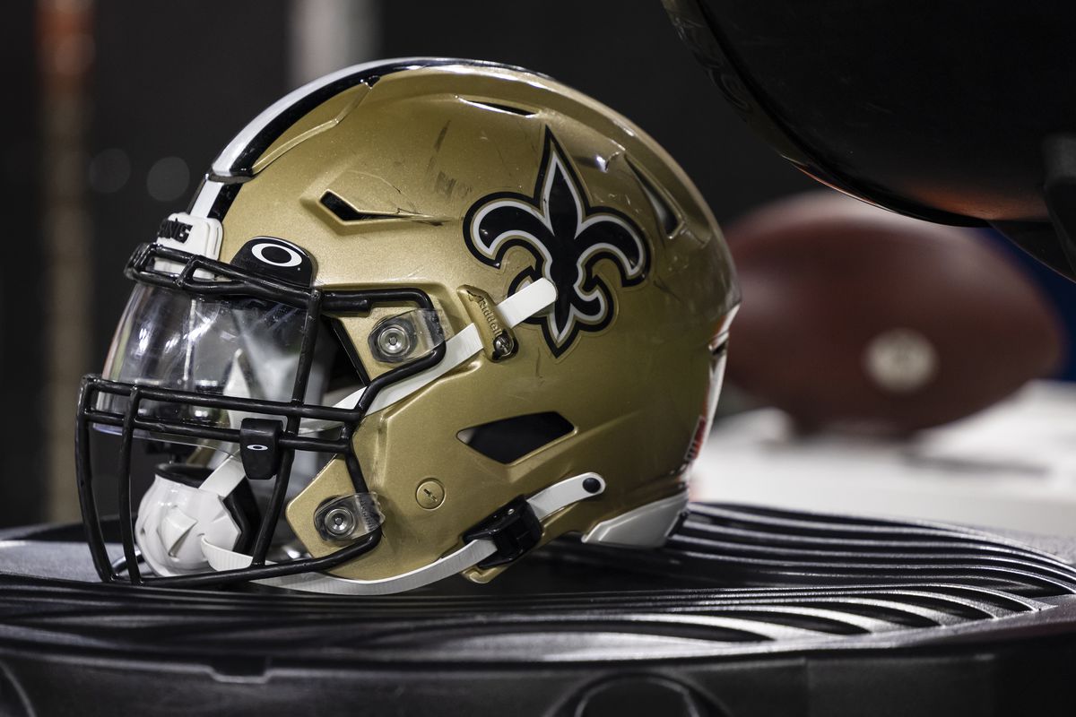 A New Orleans Saints helmet is seen on the sidelines during the second half of a preseason game against the Baltimore Ravens at M&amp;T Bank Stadium on August 14, 2021 in Baltimore, Maryland.