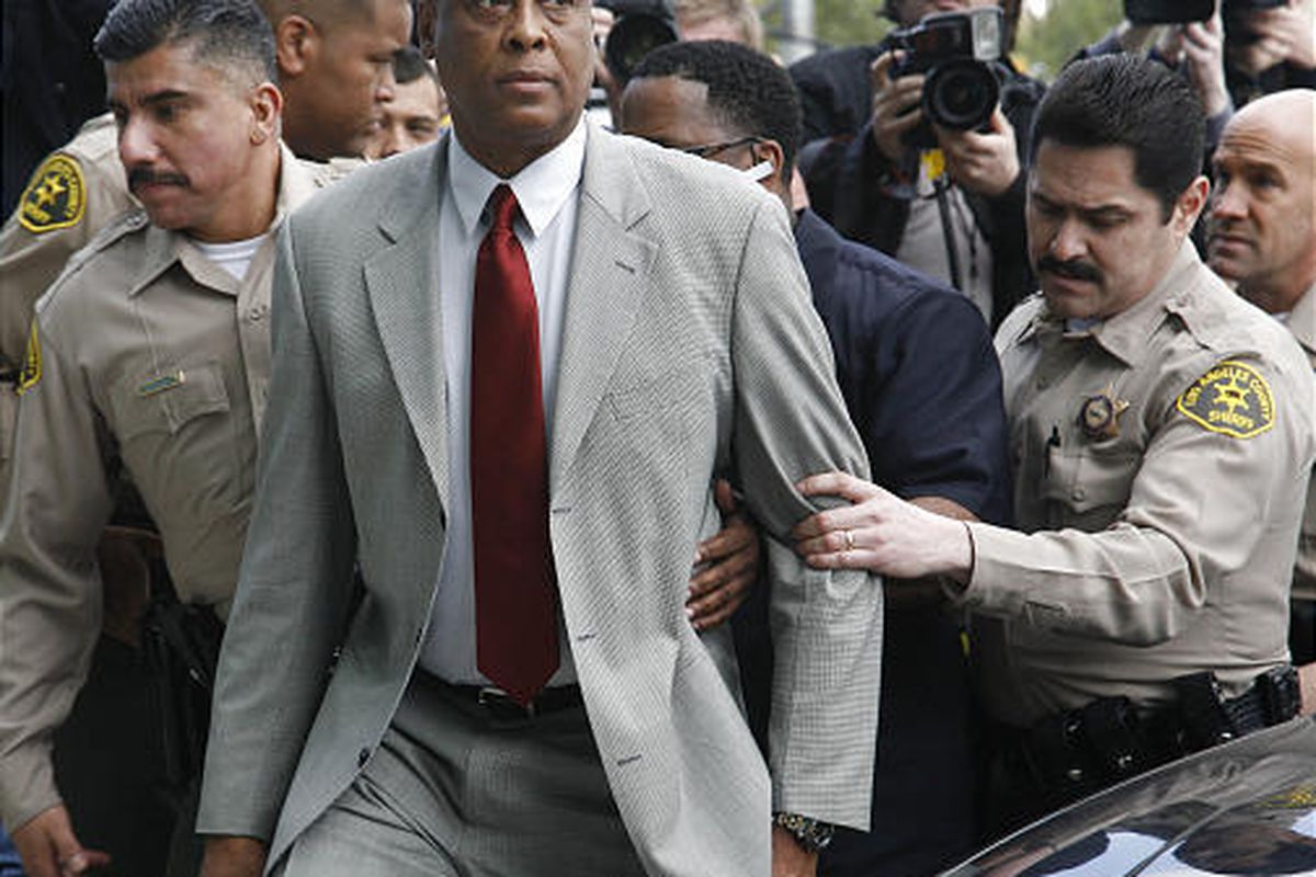 Conrad Murray, Michael Jackson's doctor, is escorted by Los Angeles County Sheriffs deputies as he arrives at the Airport Courthouse to face charges of involuntary manslaughter in the singer's death in Los Angeles on Monday.