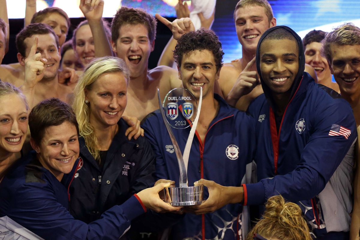 All 4 Golden Bears on Team USA are visible in this shot with the champion's trophy: from left to right, Caitlin Leverenz, Jessica Hardy, Anthony Ervin, and Tom Shields.
