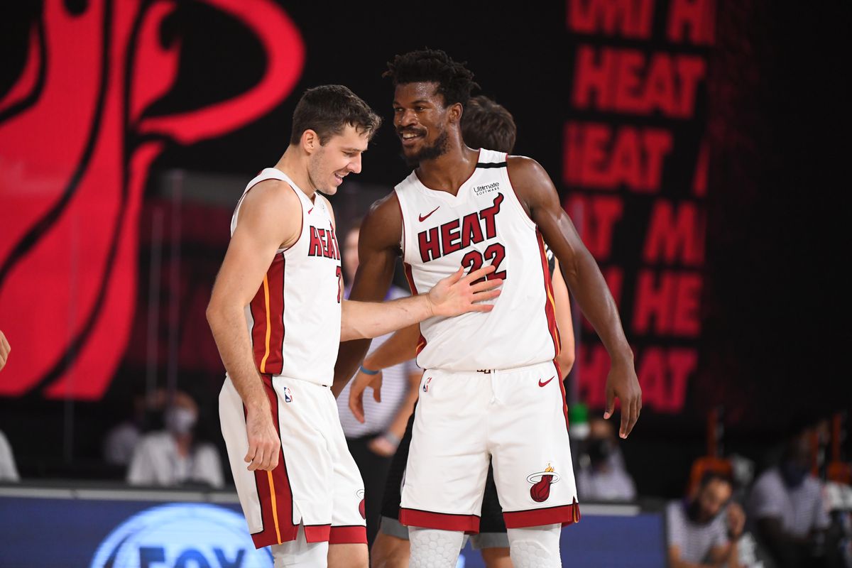 oran Dragic and Jimmy Butler of the Miami Heat talk during a scrimmage against the Sacramento Kings on July 22, 2020 at HP Field House at ESPN Wide World of Sports in Orlando, Florida.&nbsp;