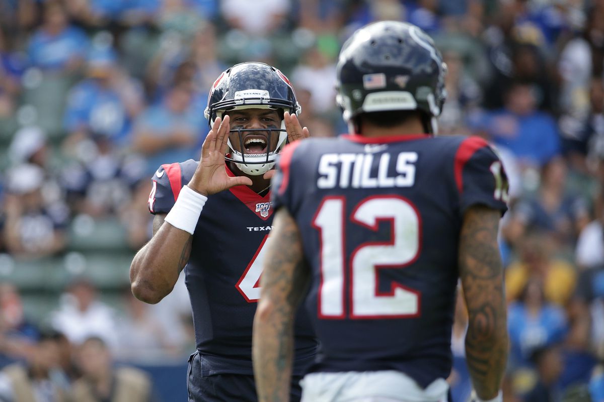 Deshaun Watson of the Houston Texans shouts instructions to Kenny Stills in the second quarter against the Los Angeles Chargers at Dignity Health Sports Park on September 22, 2019 in Carson, California.