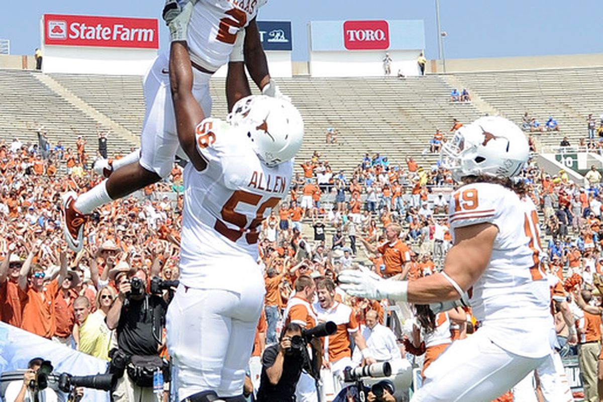 Texas players celebrate in the Rose Bowl end zone in front of some Texas fans, a lot of empty seats, and the absence of anyone wearing blue . . . at a UCLA home game.  Pathetic.