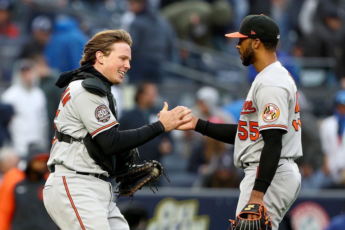 Adley Rutschman and Dillon Tate shake hands after the Orioles beat the Yankees