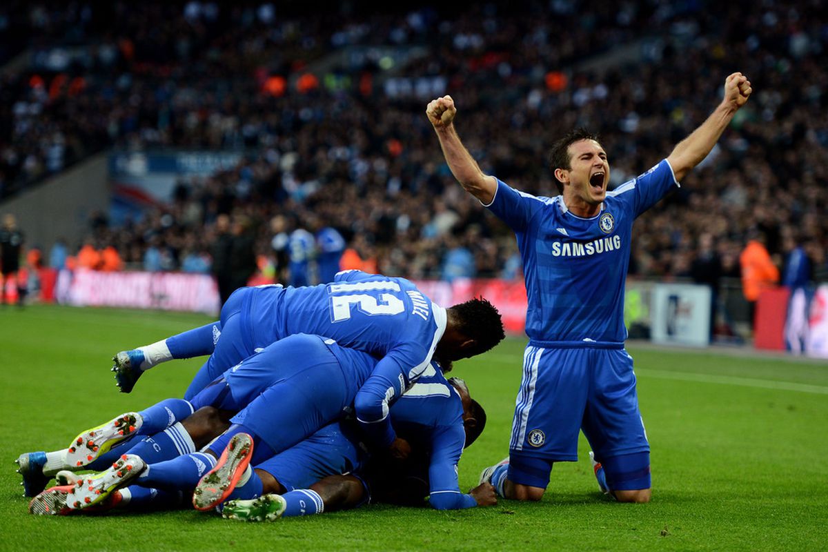 Frank Lampard celebrate's Chelsea FC's successful attempt to bury Ramires (obscured) alive.