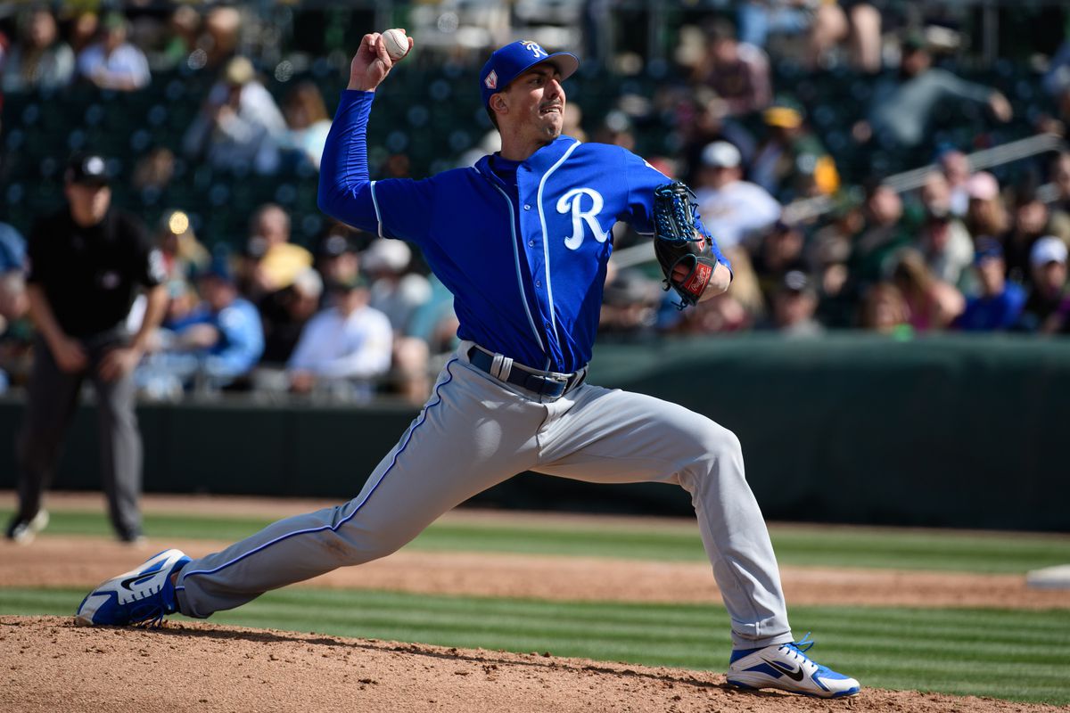 Kyle Zimmer #45 of the Kansas City Royals delivers a pitch in the spring training game against the Oakland Athletics at HoHoKam Stadium on February 24, 2019 in Mesa, Arizona.