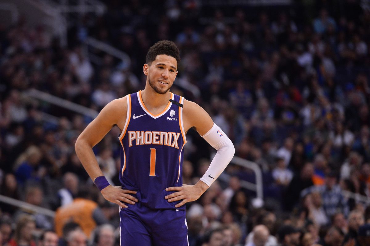 Phoenix Suns guard Devin Booker looks on against the Golden State Warriors during the second half at Talking Stick Resort Arena.&nbsp;