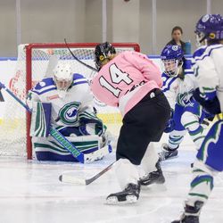 Connecticut Whale goaltender Sydney Rossman makes a save on a shot from Buffalo Beauts forward Hayley Scamurra.