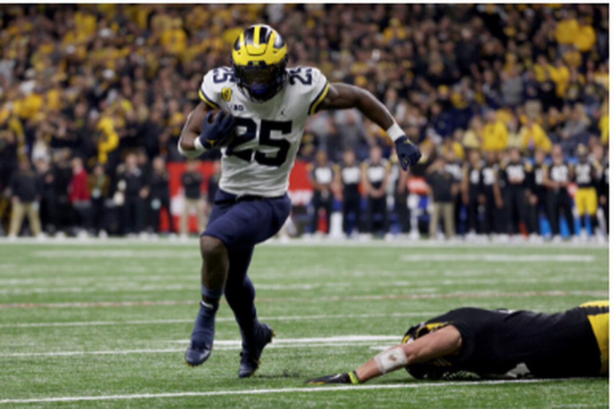 Michigan running back Hassan Haskins ran for two touchdowns in the second half and broke the school record for TDs in a single season with 20.