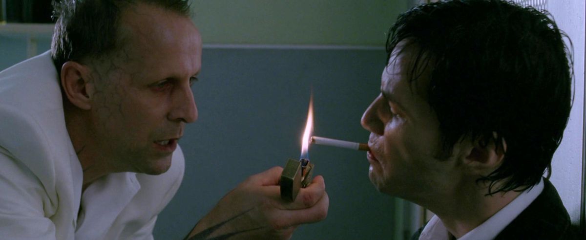 Satan lights a cigarette for Constantine