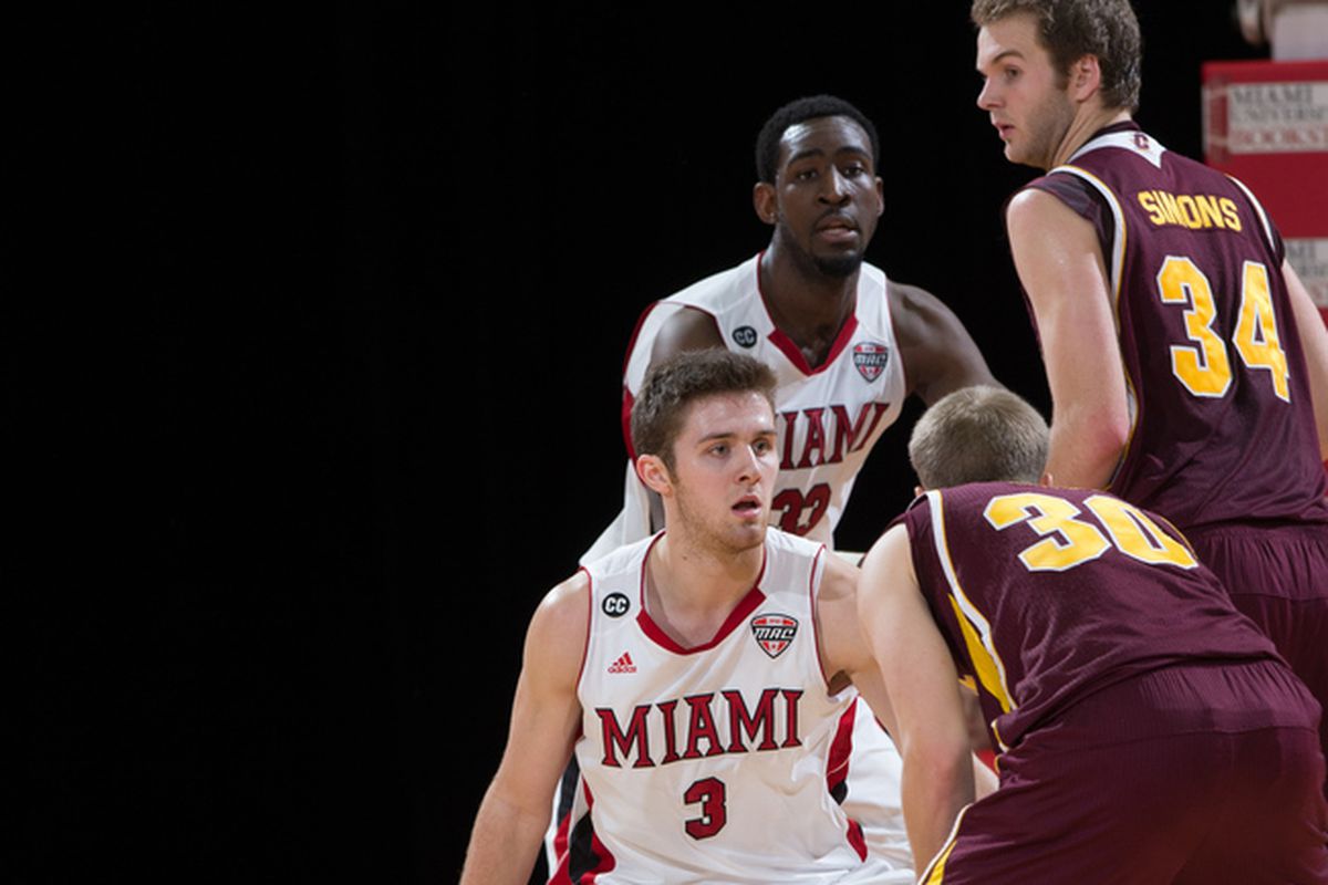Will Sullivan (foreground) and Will Felder (background) defend a pair of CMU players in a game last week.