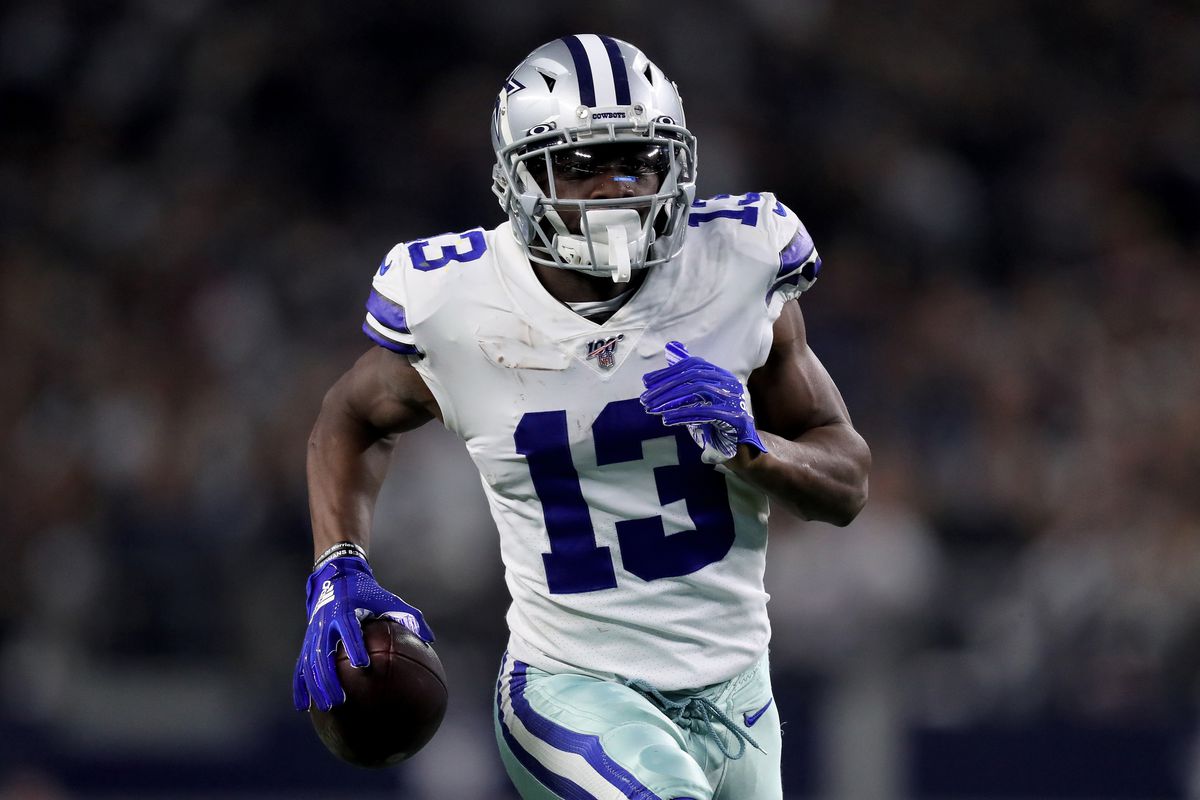 Michael Gallup of the Dallas Cowboys runs with the ball in the fourth quarter against the Washington Redskins in the game at AT&amp;T Stadium on December 29, 2019 in Arlington, Texas.