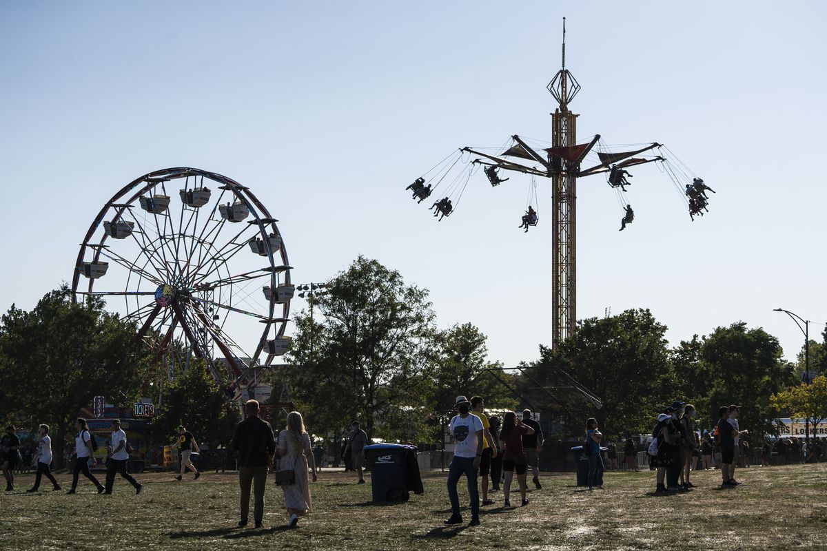 Fans head to the carnival at Riot Fest on Day 1 of the event in Douglass Park.