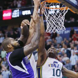 Utah Jazz point guard Alec Burks (10) is fouled by Sacramento Kings power forward Patrick Patterson (9)  during NBA action in Salt Lake City  Saturday, Dec. 7, 2013.  The Kings won 112-102. 