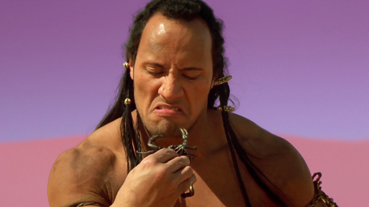 Actor The Rock holds a scorpion from the movie, The Mummy