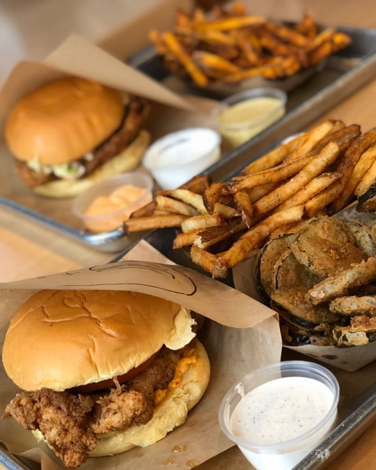 Fried chicken sandwich, French fries, and fried pickles from Boxcar Betty’s, opening in Atlanta in 2022. 