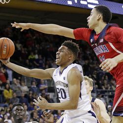 Arizona's Chance Comanche, right, defends as Washington's Markelle Fultz looks for a shot during the second half of an NCAA college basketball game in Seattle. Fultz will be among those taking part in the Utah Summer League.