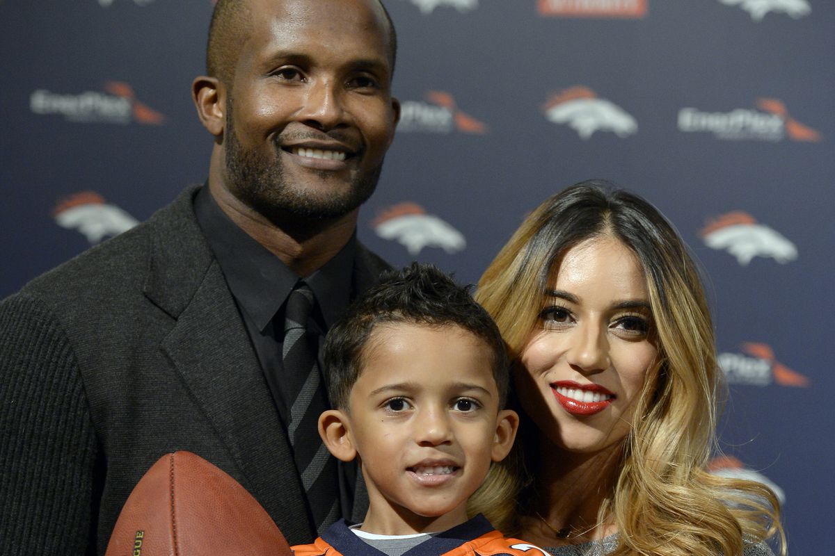 Denver Broncos Champ Bailey with his wife Jessica and his son Brayden as they smile for the cameras after his press conference to announcing his retirement as a Denver Bronco November 18, 2014 at Dove Valley.