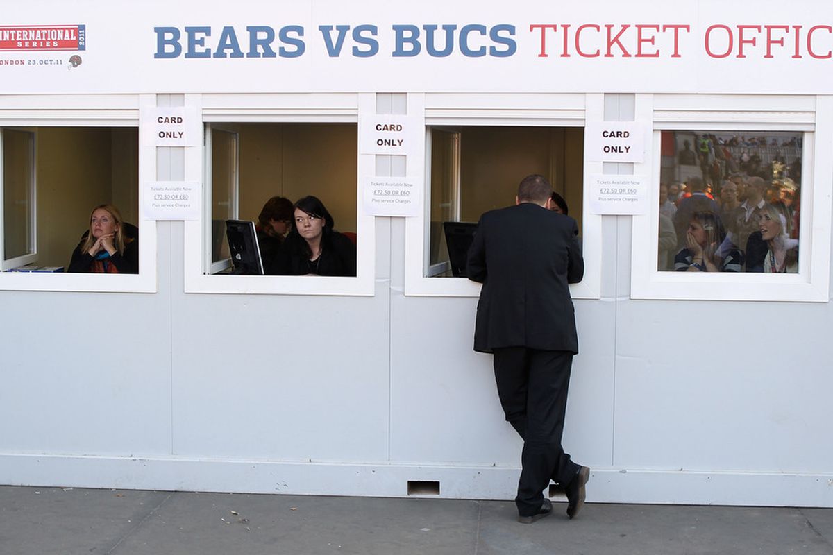 LONDON, ENGLAND - OCTOBER 22:  A fan purchases tickets ahead of the Chicago Bears versus Tampa Bay Buccaneers game during the NFL Fan Rally at Trafalgar Square on October 22, 2011 in London, England.  (Photo by Streeter Lecka/Getty Images)