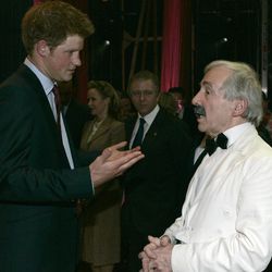 FILE - In this Wednesday, Nov. 12, 2008 file photo, Britain's Prince Harry talks to British actor Andrew Sachs backstage at the Wimbledon Theatre after a charity performance in aid of the Prince's Trust charity, in London. Comic actor Andrew Sachs, known primarily for his role as Manuel in the 1970s situation comedy Fawlty Towers, has died it was announced Thursday, Dec. 1, 2016. He was 86 and had been suffering from vascular dementia. 
