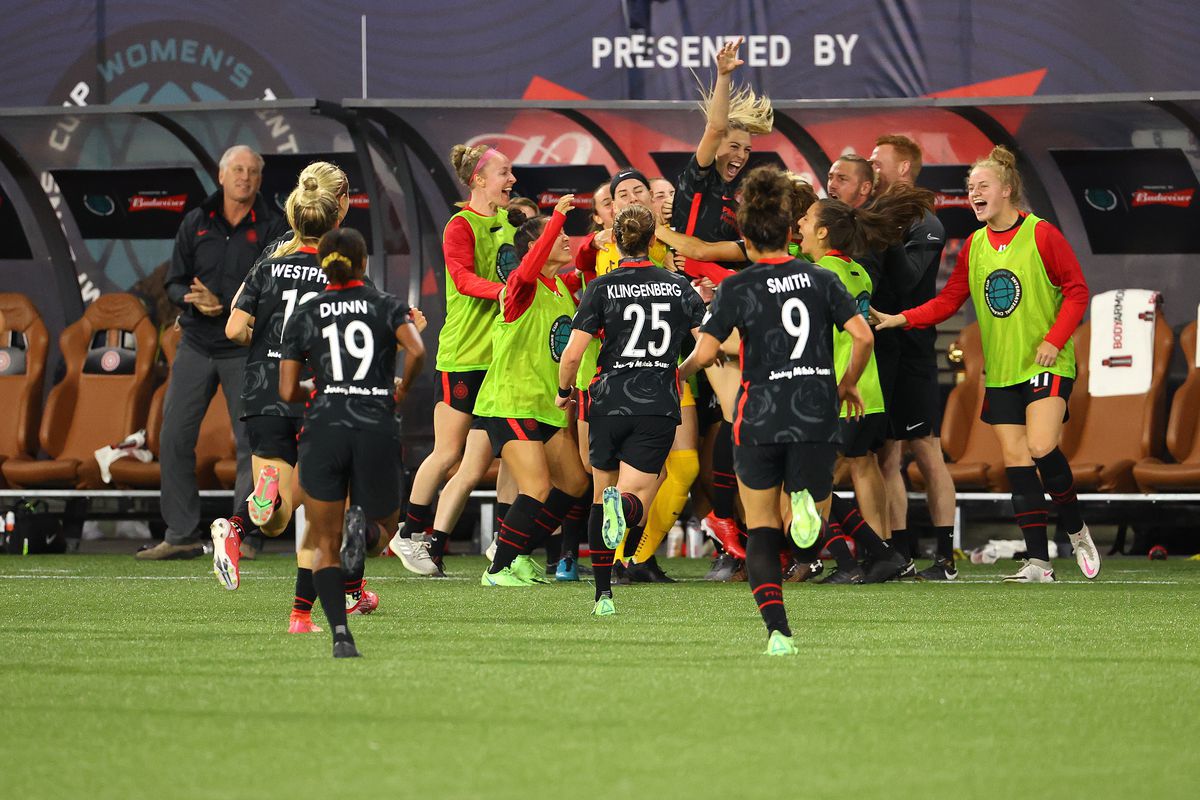 Morgan Weaver celebrates with Portland Thorns teammates at Providence Park in the WICC 