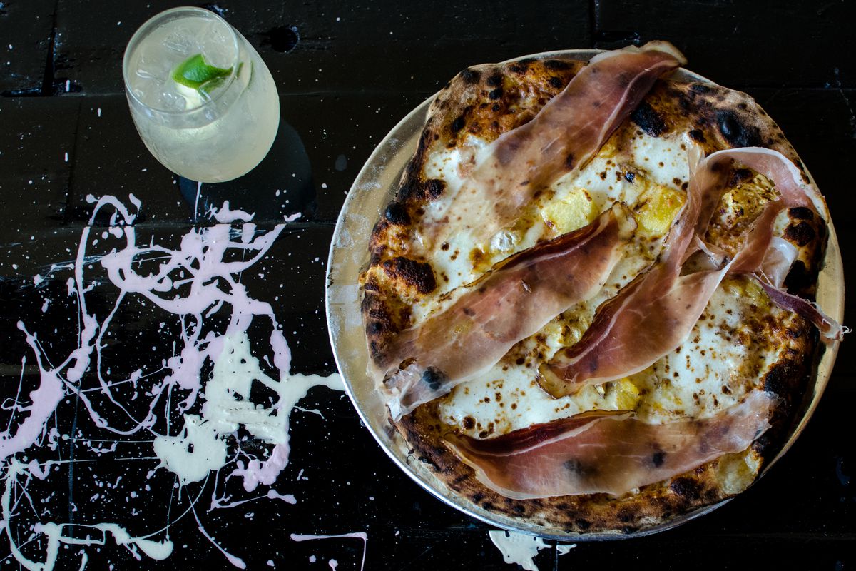 T&amp;B Pizza’s pineapple pizza: Tyrolean smoked ham, rum-soaked pineapple, and Jasper Hill Harbison cheese. A spritz on the side (Cocchi Americano, Italicus Rosolio Bergamot Liqueur, prosecco, lime).