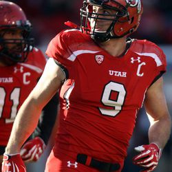 Utah defensive end Trevor Reilly (9) looks up at the crowd after making an interception and throwing the ball into the crowd at the end of a football game against Colorado at the Rice-Eccles Stadium in Salt Lake City on Saturday, Nov. 30, 2013. Utah won 24-17.