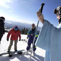University of Montana freshmen Jake Coburn, Stephanie Ralls and Claire Dal Nogare visit the statue of Jesus Christ at Whitefish Mountain Resort, Whitefish, Mont., in 2011.