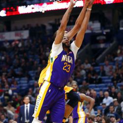 New Orleans Pelicans forward Anthony Davis (23) is fouled by Utah Jazz center Rudy Gobert as they battle for a rebound in the second half of an NBA basketball game in New Orleans, Monday, Feb. 5, 2018. The Jazz won 133-109. (AP Photo/Gerald Herbert)