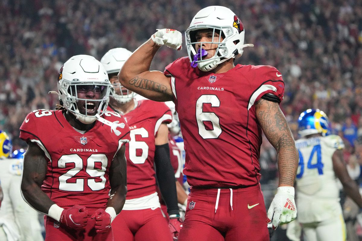 Arizona Cardinals running back James Conner (6) celebrates after scoring a rushing touchdown against the Los Angeles Rams during the fourth quarter at State Farm Stadium.&nbsp;