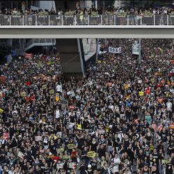 Protesters take part in a rally on Monday, July 1, 2019, in Hong Kong. Combative protesters tried to break into the Hong Kong legislature Monday as a crowd of thousands prepared to start a march in that direction on the 22nd anniversary of the former British colony's return to China. (AP Photo/Vincent Yu)