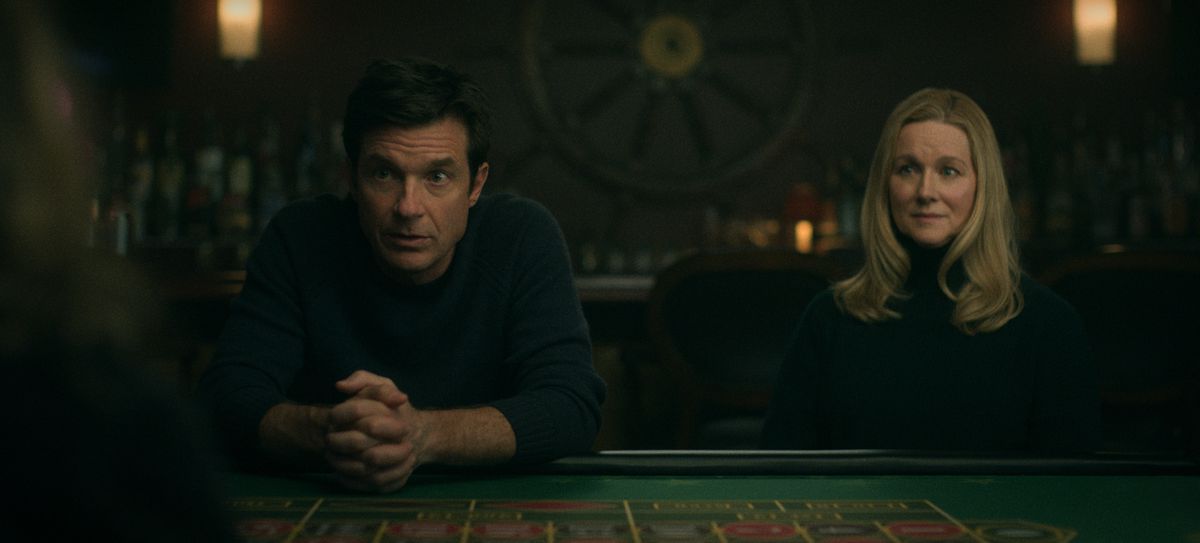 Jason Bateman as Martin 'Marty' Byrde, Laura Linney as Wendy Byrde sitting at a casino table in Ozark