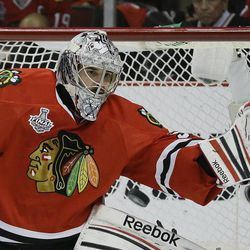Chicago Blackhawks goalie Corey Crawford (50) reaches to glove a shot by the Boston Bruins in the first period during Game 5 of the NHL hockey Stanley Cup Finals, Saturday, June 22, 2013, in Chicago. (AP Photo/Nam Y. Huh)