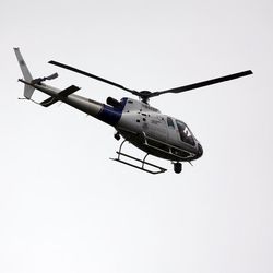A law enforcement helicopter aids in the search for two prison escapees from Clinton Correctional Facility in Dannemora, on Tuesday, June 23, 2015, in Malone, N.Y.  Police began focusing intensely on an area 20 miles west of the prison that inmates David Sweat and Richard Matt escaped on June 6. 