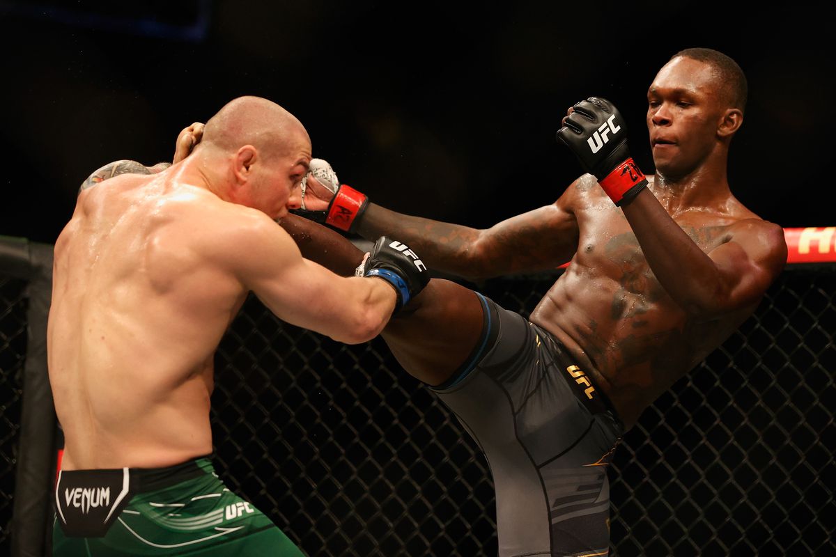 Israel Adesanya lands a head kick on Marvin Vettori in their UFC 263 title bout.