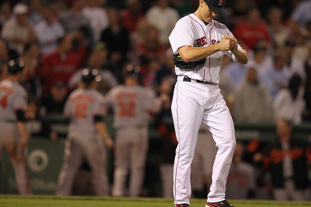 BOSTON, MA - SEPTEMBER 20: Jonathan Papelbon #58 of the Boston Red Sox reacts to three runs scored after he gave up a hit by Robert Andino #11 of the Baltimore Orioles the 8th inning at Fenway Park.