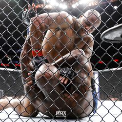 Daniel Cormier battles Derrick Lewis on the ground at UFC 230.